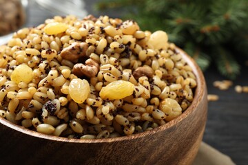 Traditional Christmas slavic dish kutia in bowl on table, closeup