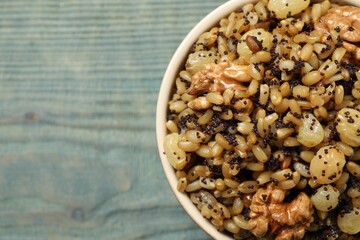 Traditional Christmas slavic dish kutia on light blue table, top view. Space for text