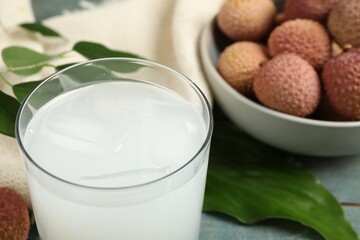 Freshly made lychee juice on table, closeup