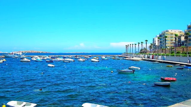 Bugibba is the popular tourist resort, stretching along the St Paul's Bay and boasting idyllic nature, scenic harbour with numerous fishing and pleasure boats, perfect for the tourist trips, Malta. 