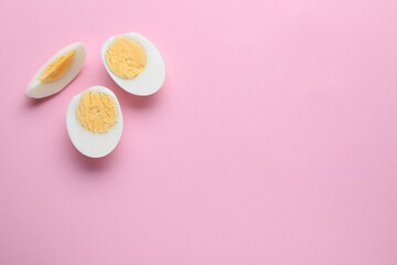 Fresh hard boiled eggs on pink background, flat lay. Space for text - obrazy, fototapety, plakaty