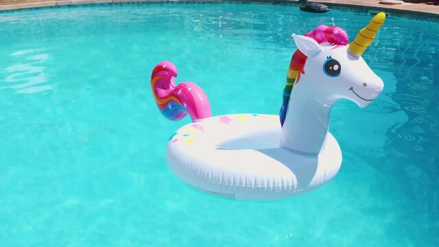inflatable circle in the form of a unicorn in the pool