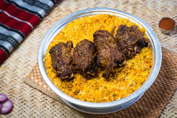 Arabian Mutabbaq meat Samak rice or Motabaq Chicken served in dish top view of middle east food