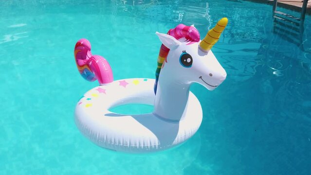 inflatable circle in the form of a unicorn in the pool