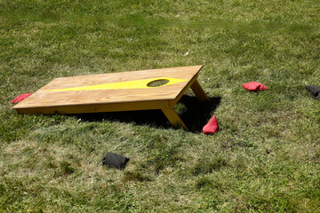 corn hole, bean bag toss game on the lawn