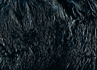 Grunge background. Creased texture. Uneven film structure. Blue white black ripples on distressed rough dark abstract illustration overlay.