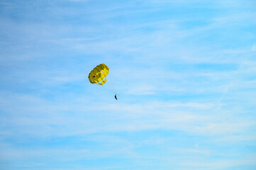Parasailing on the sea. towed parachute against blue sky. Parachute and boat on the sea at summer....