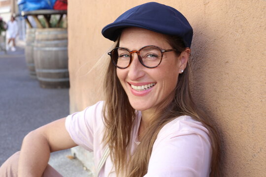 Cute woman wearing vintage style hat and eyeglasses 