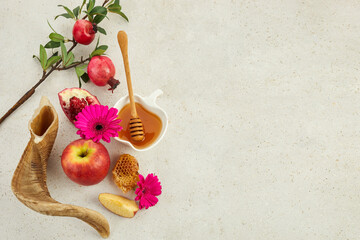 Rosh hashanah, jewish New Year holiday concept. Pomegranate, apples and honey traditional products for celebration