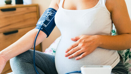 Pregnant blood test hypertension pressure. Pregnancy mother with blood test sphygmomanometer check pressure. Pregnancy, medicine health care concept. - obrazy, fototapety, plakaty
