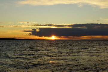 Naklejka premium sunset over the river 