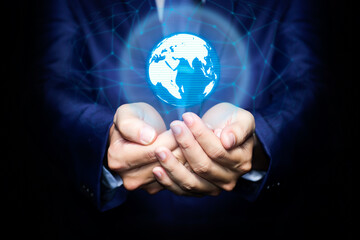 Global business world in hand, Businessman holding the 3D digital illusion planet on dark black background, communicate, connection, technology, worldwide, network, internet concept.