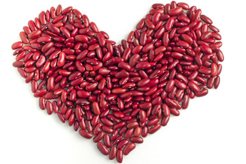 Plakat red kidney beans arranged in a heart shape on a white background. lover and valentine concept.