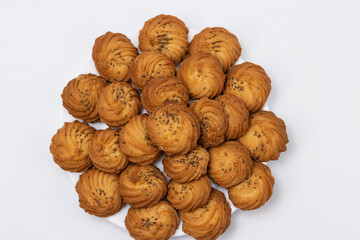 Cookies or biscuit stacked on plate for breakfast or snacks, a healthy concept lifestyle with copy space for text isolated on white background top view