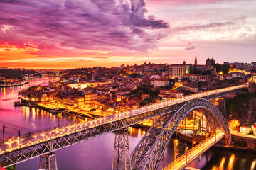 Fototapeta na wymiar Porto Aerial Cityscape with Luis I Bridge and Douro River at Amazing Sunset
