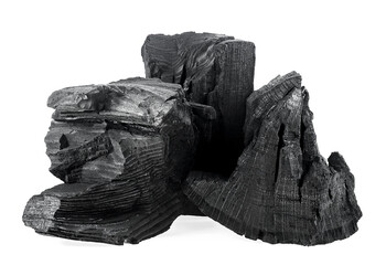 Pile of natural wood charcoal pieces isolated on a white background. Black charcoal.