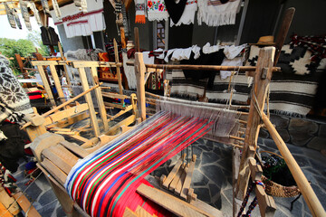 Old traditional weaving loom in a household where people learn to make wool cloth, woolen stockings...