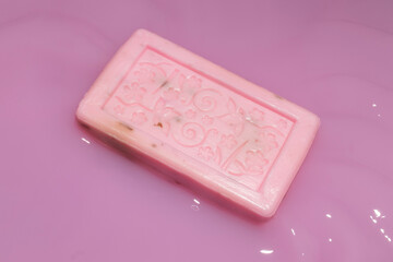 Natural rose soaps  in pink liquid.