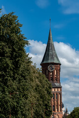  Clock on the Cathedral Ostrov Kant Kaliningrad. a large vertical frame of a medieval cathedral. German Russian architecture, Christianity, Catholicism. tourism in russia kaliningrad region