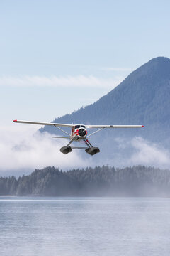 Seaplane Flying over the West Coast Pacific Ocean. Adventure Composite. 3D Rendering Airplane. Background Image from Tofino, Vancouver Island, British Columbia, Canada.