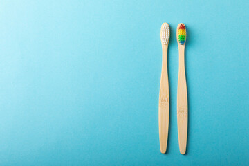 Toothbrushes. Oral care. Dental care. Composition with bamboo toothbrushes on a blue background. Eco friendly.Copy space. Place for text.Fletley
