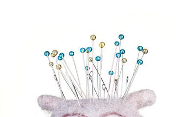 pincushion in the form of an owl on a white background