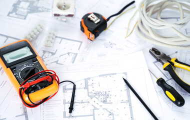 Making repairs,planning electricity project in house.Drawings,diagrams,plan for electrification of...