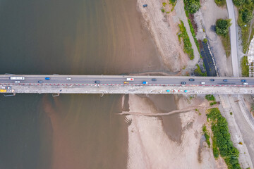 Work to construction and repair of highway bridge, aerial top view
