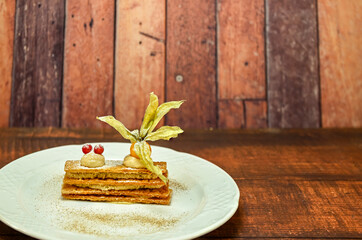 Crunchy inverted puff pastry mille-feuille with caramel and toffee mousse.