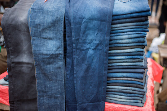 Men's jeans were displayed for sale in Lagos - Nigeria’s largest city, despite the rapidly increasing cost of living - clothes in a row