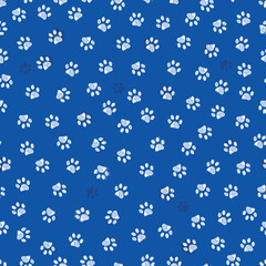 Blue background with white paw prints seamless fabric pattern