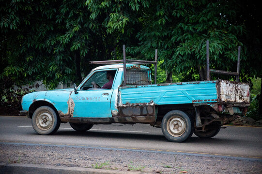 old truck on the road - A blue truck on the highway in Abuja, NIGERIA, on July 26, 2022. Everyday life in Northern Region, Nigeria