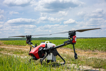 Fototapeta na wymiar A modern solution in agricultural. Use of robotic systems with agriculture spraying drone fly to sprayed spraying chemical from insects - insecticides, fungicides, acaricide, or herbicides from weeds.