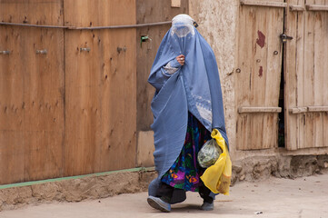 Bamyian, Afghanistan - May 2004: Woman in burqa in the Bamyian Valley