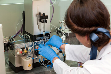 Technician preparing chemical radioactive contrast agent medicine for radiology and nuclear...