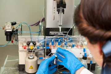 Technician preparing chemical radioactive contrast agent medicine for radiology and nuclear...