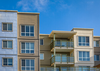 Brand new apartment building on sunny day in BC, Canada. Architectural details of modern apartment building