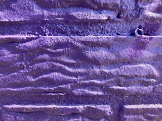 Fototapeta na wymiar A bright purple painted wall