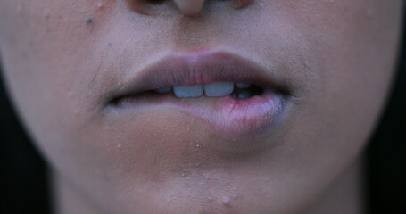 Fototapeta premium Sensual african woman biting lips in macro