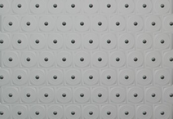 circular gray pattern with black dots on it