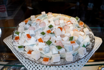 Pile of colorful Turkish delight on display in the showcase. Selective Focus.