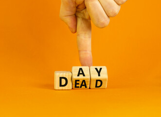 Day of the dead symbol. Concept words Day of the dead. Man hand. Beautiful orange table orange background. Day of the dead concept. Copy space.