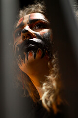 A woman with a halloween make-up looking away