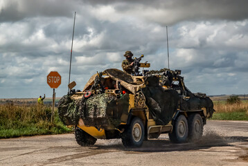 army reconnaissance vehicle in action on a military exercise