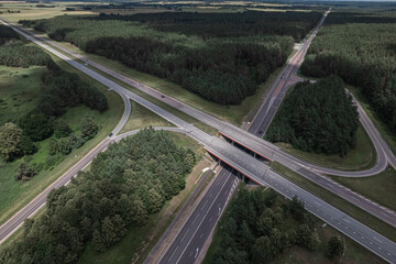 Multi-lane highway bridges over road in the countryside