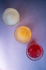 glasses set with fruit fresh colored juice of berry, lemon, ginger, strawberry