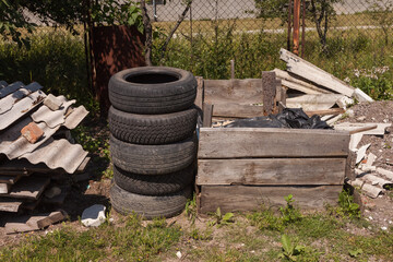 Stacked old car tires in the backyard