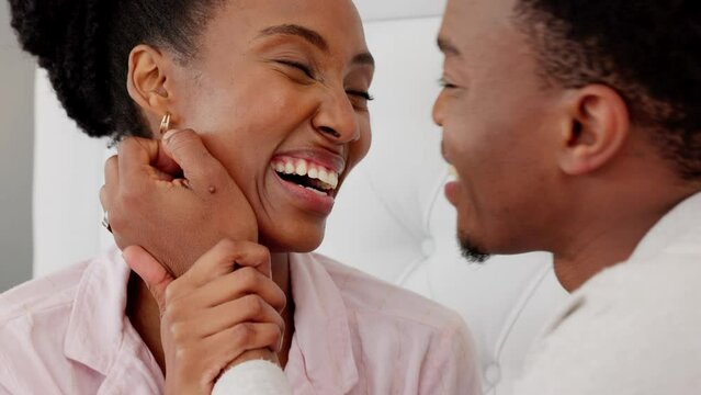 African couple with love, care in marriage and funny conversation in bed, talking in the morning and happy with communication in bedroom. Romantic, smile and affection man and woman relax in house