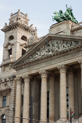 Portion of the exterior of the Museum of Ethnography in Budapest, Hungary. The building is located at Kossuth Square near the Hungarian Parliament House. Many statues are decorating the facade,