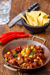 chili con carne on wood